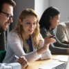 Book a Demo with Purview Blog image. This is a picture of 4 colleagues looking at laptop screens